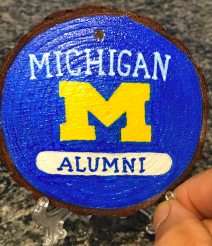 Michigan University Alumni 'M' painted on wood slice