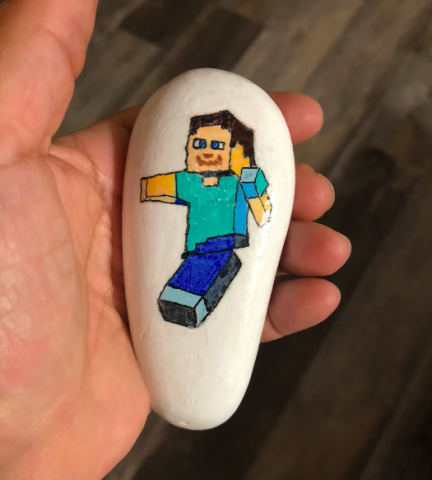 Minecraft character painted on a rock