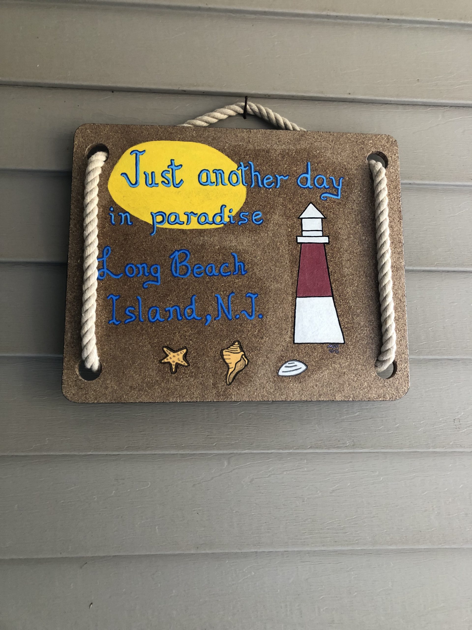 Just another day in paradise wood painting featuring lighthouse