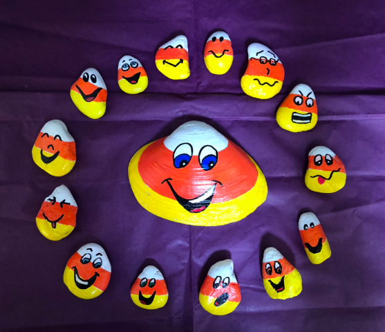 Candy corn people painted on shell and rocks
