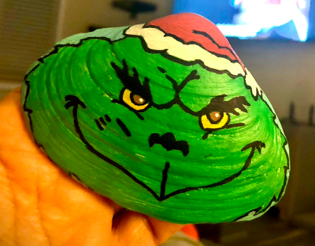 The Grinch painted on a clamshell