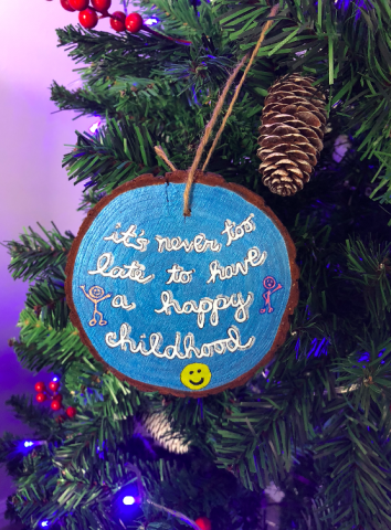Happy childhood quote painted wood ornament